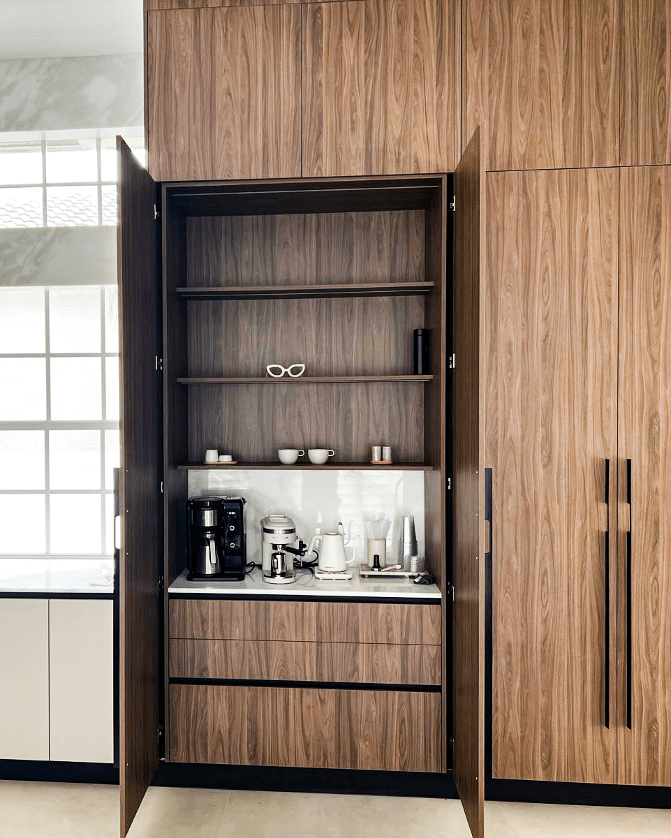 Built-in wooden kitchen cabinet with coffee station and appliances