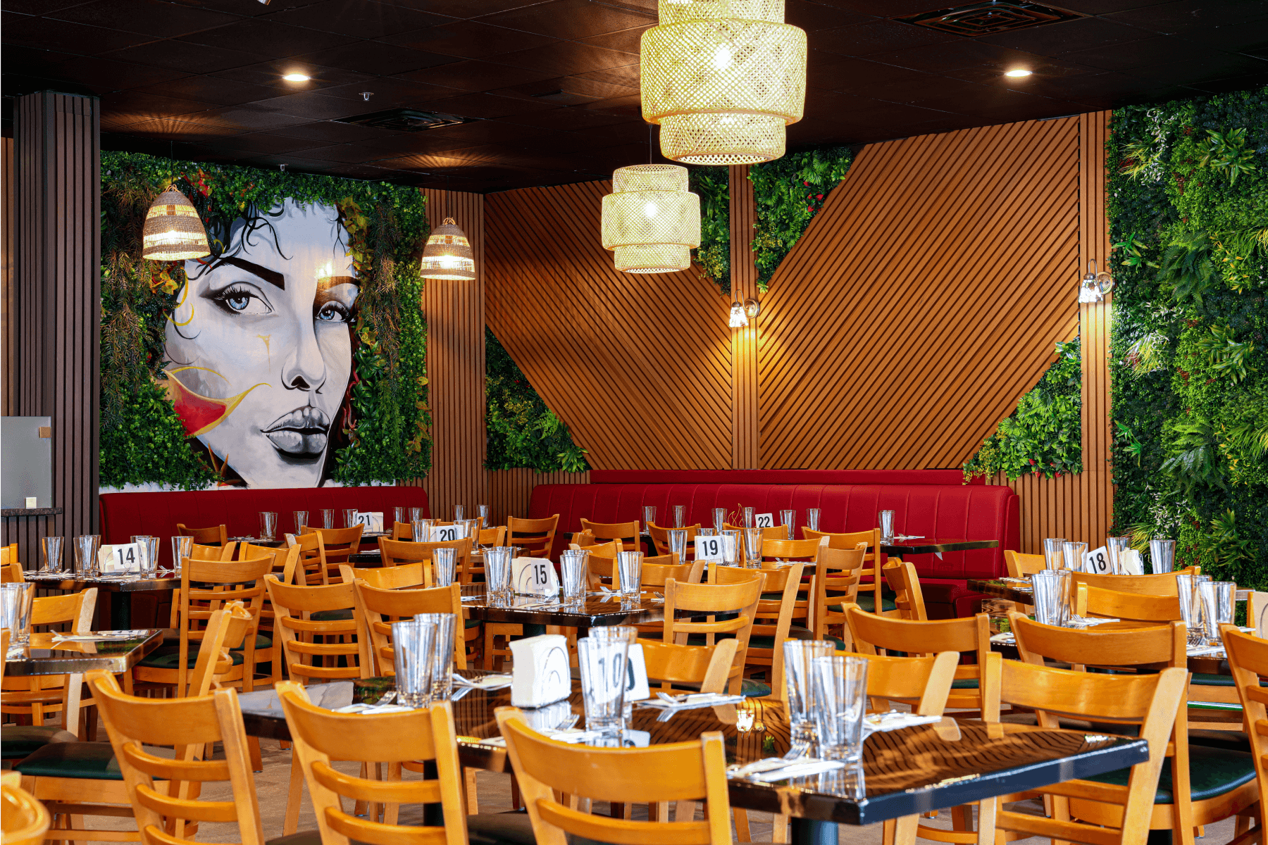 Restaurant interior with wall art mural and greenery decor