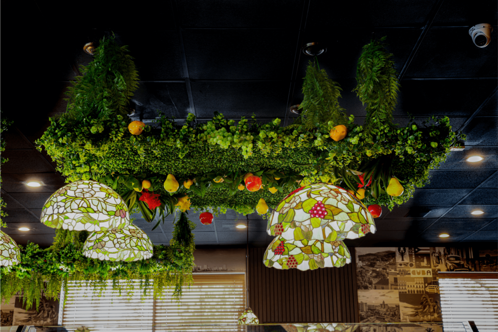 Hanging greenery decor with fruit and stained glass pendant lights