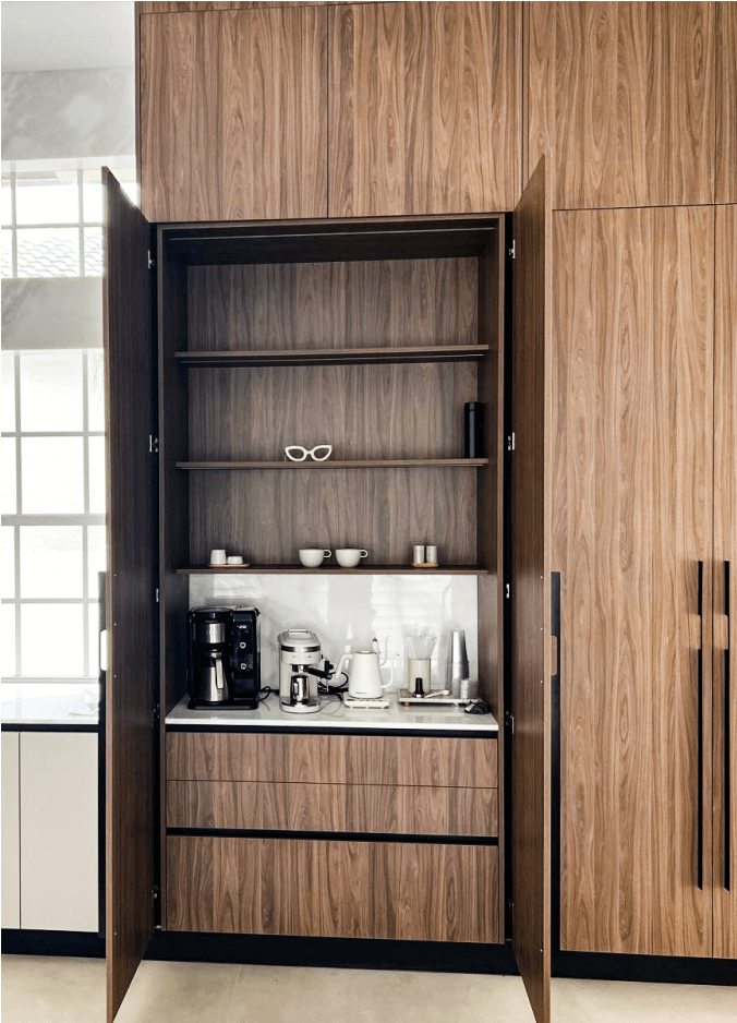 Built-in wooden kitchen cabinet with coffee station and appliances